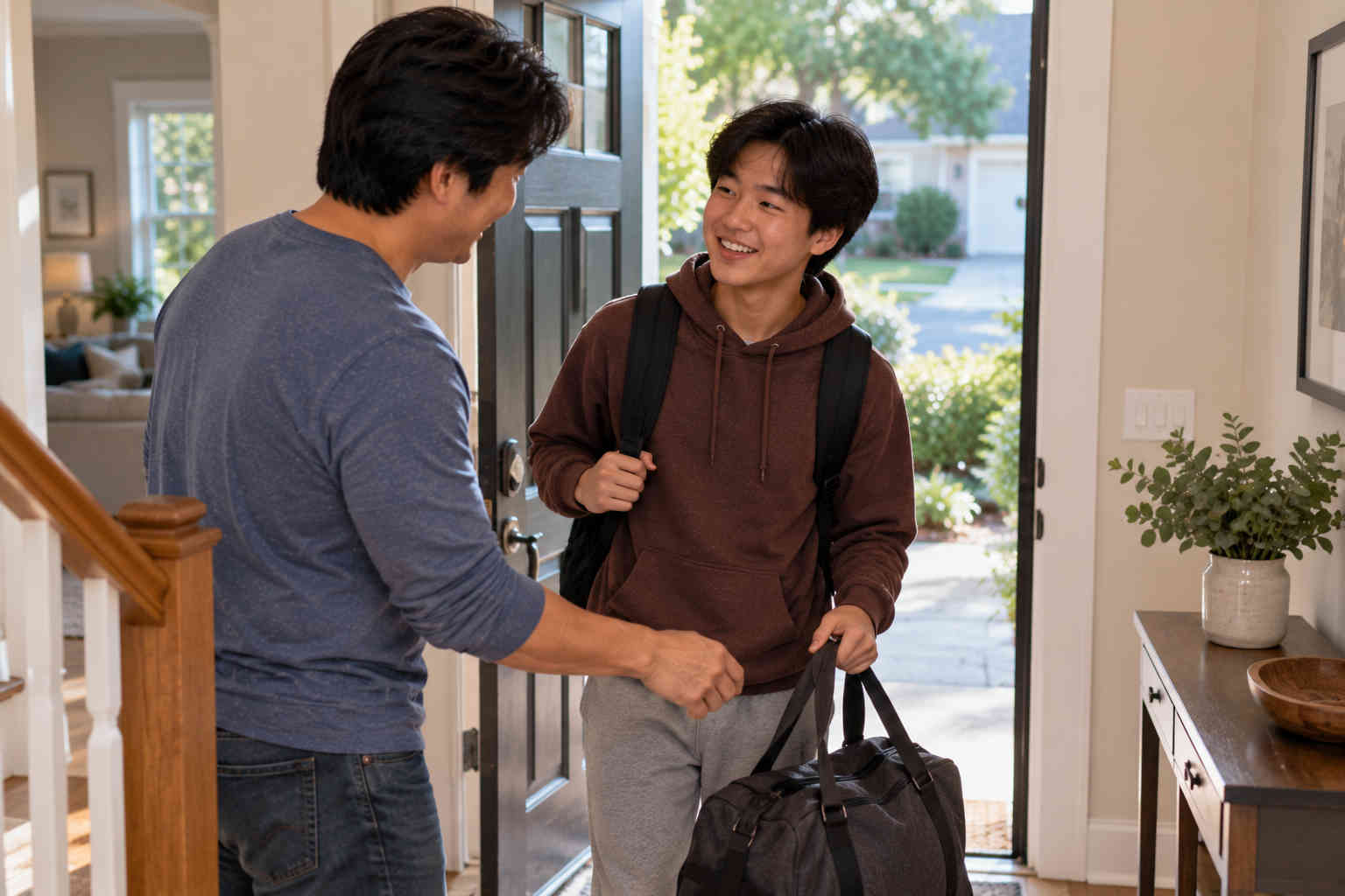 Korean father warmly welcoming his teenage son for parenting time