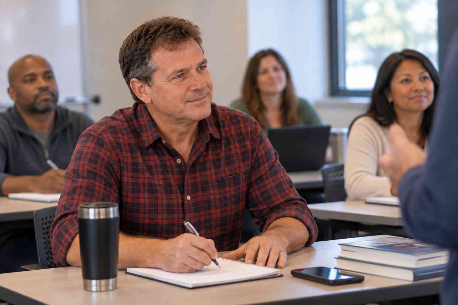 Man attending a class and learning new career skills after divorce